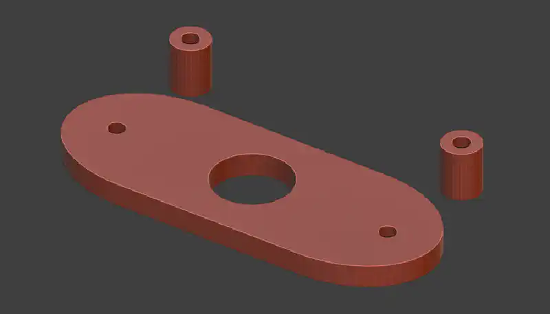 Blenderでのモデリング画面。プレート中央の穴にメタルマウントが収まり、両サイドの穴とチューブでモニターに固定する。